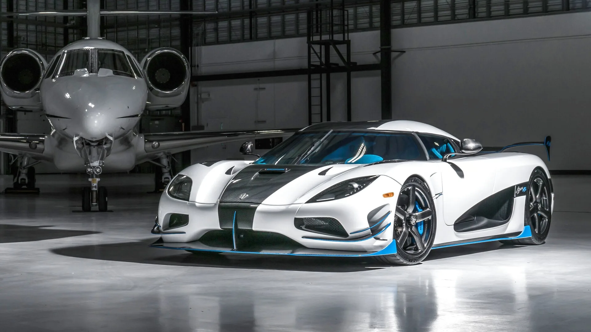 Private jet and supercar in a hangar — XPEL protection for marine and aircraft by Sam's Window Tinting