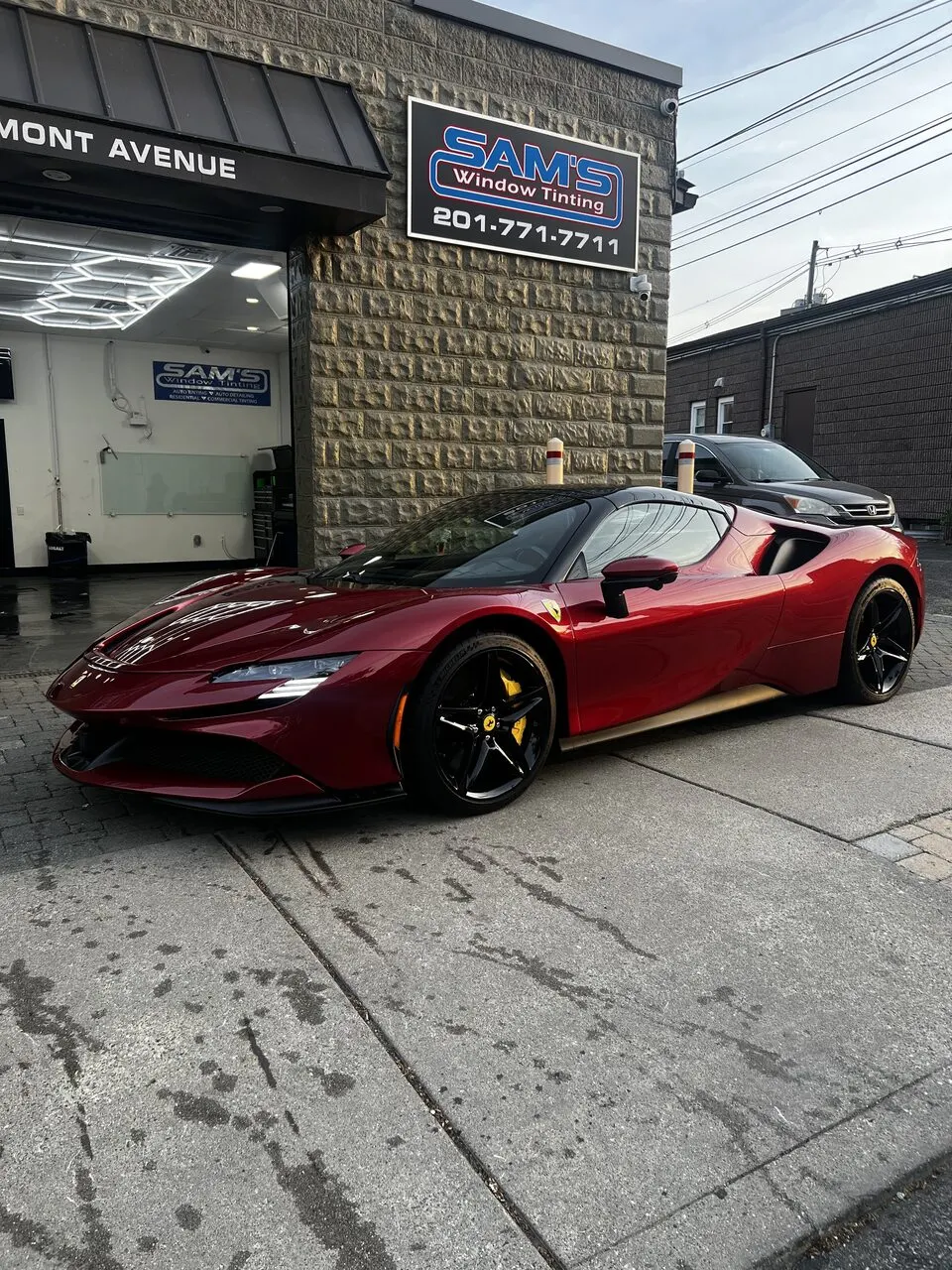 Red Ferrari SF90 at Sam's Window Tinting in Dumont, NJ