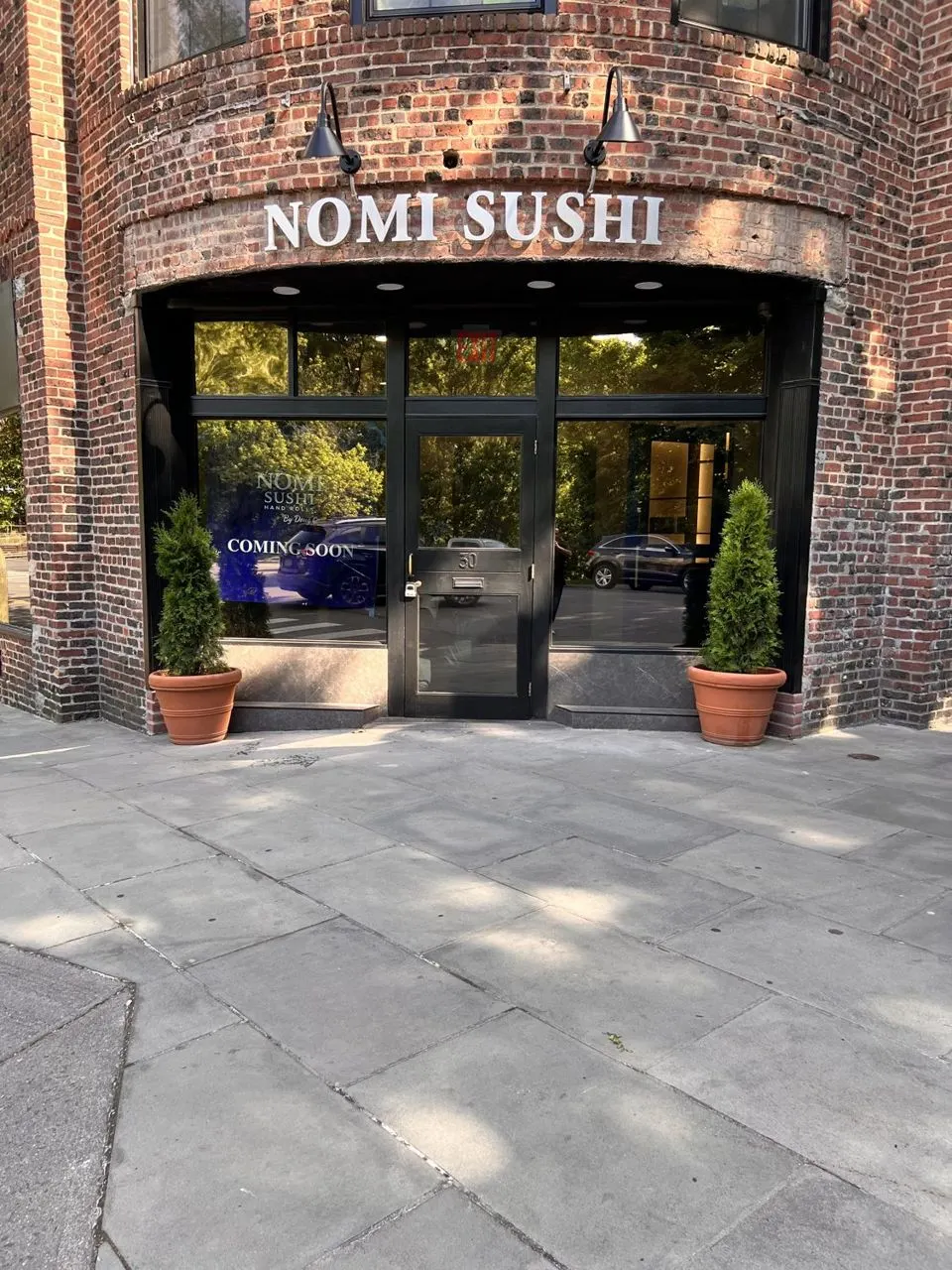 Nomi Sushi storefront with commercial window film by Sam's Window Tinting