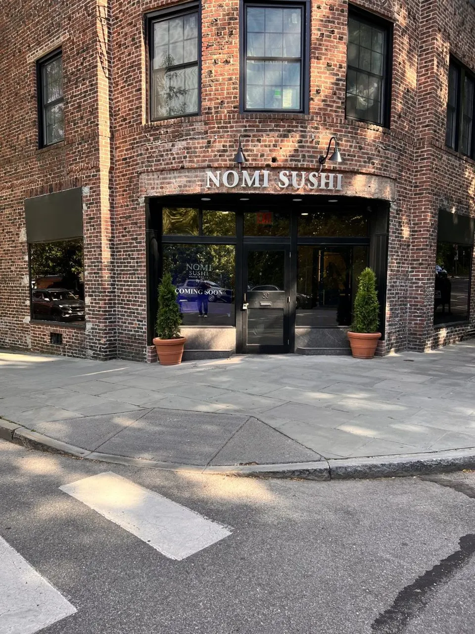 Commercial storefront windows filmed at Nomi Sushi